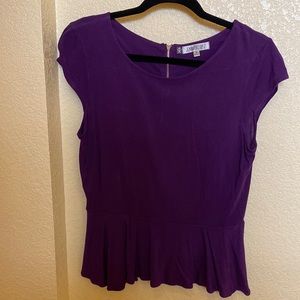 JENNIFER LOPEZ - Peplum short sleeved blouse in a rich purple.